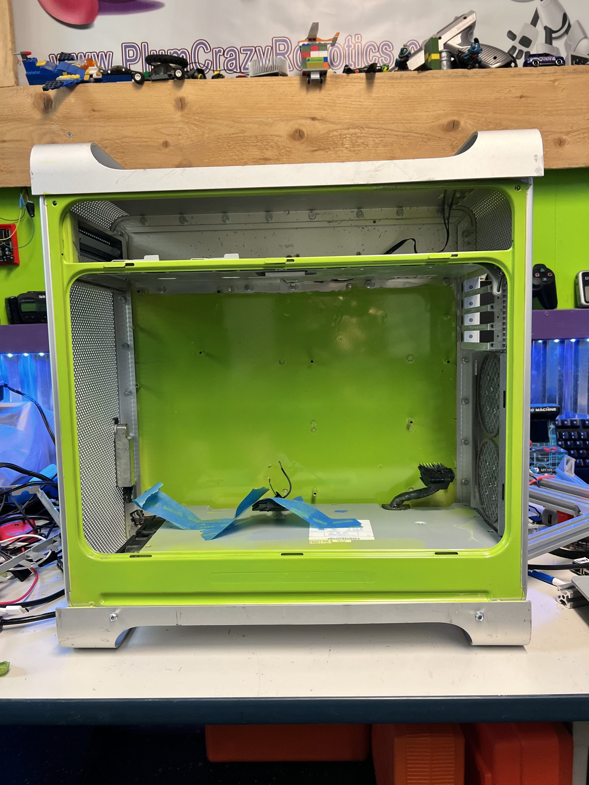 Custom painted green PC case open and empty ready for build project at Plum Crazy Robotics lab