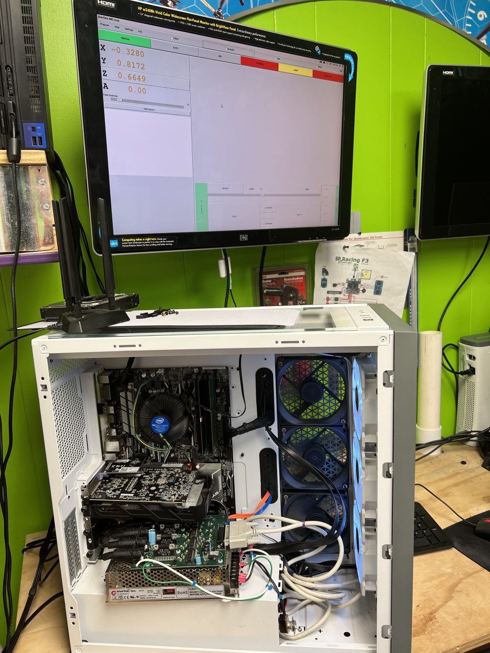 CNC mill and gaming PC workstation with coordinate display at Plum Crazy Robotics Marlboro NJ