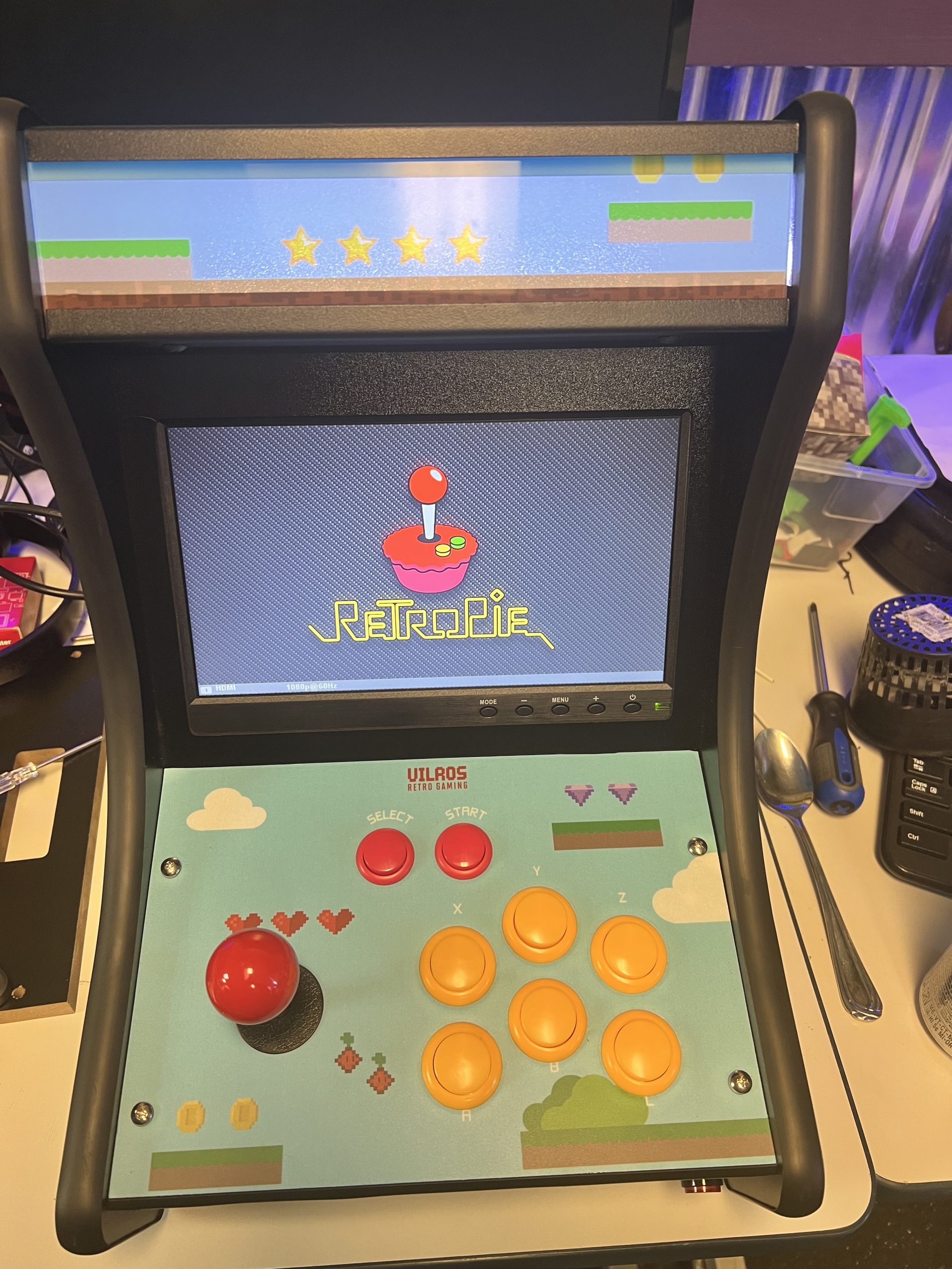 Completed Raspberry Pi RetroPie arcade cabinet with joystick and buttons at Plum Crazy Robotics lab